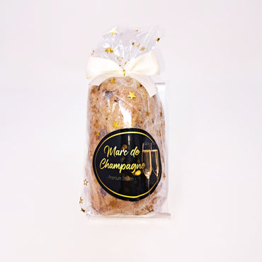 Champagner Stollen in Folie mit weißer Schleife (Geschenkidee)